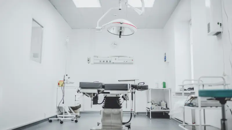 Operating room with surgical table and overhead light