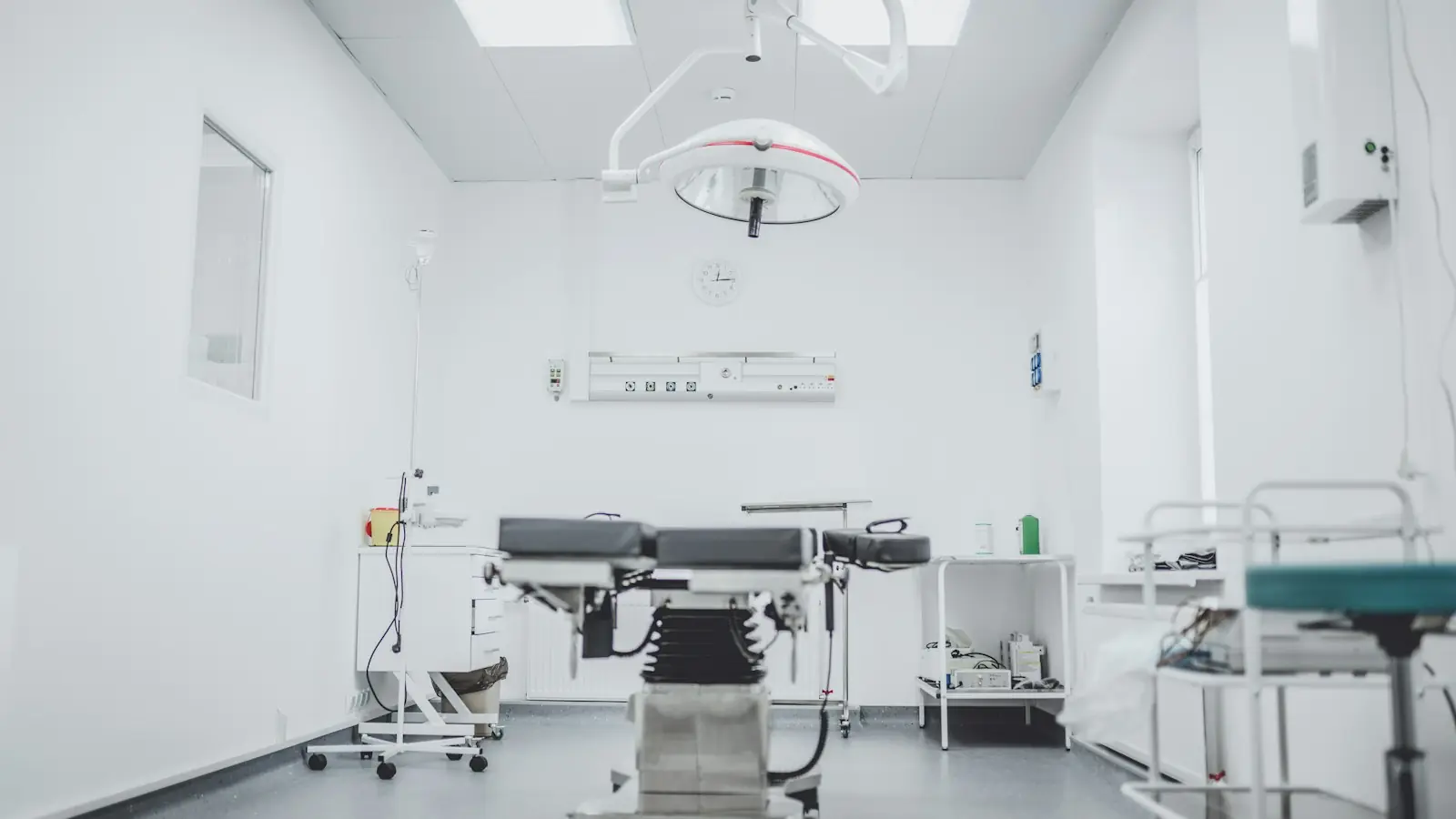 Operating room with surgical table and overhead light