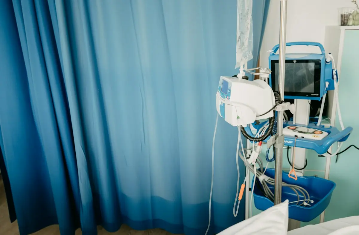 Hospital room with a blue privacy curtain