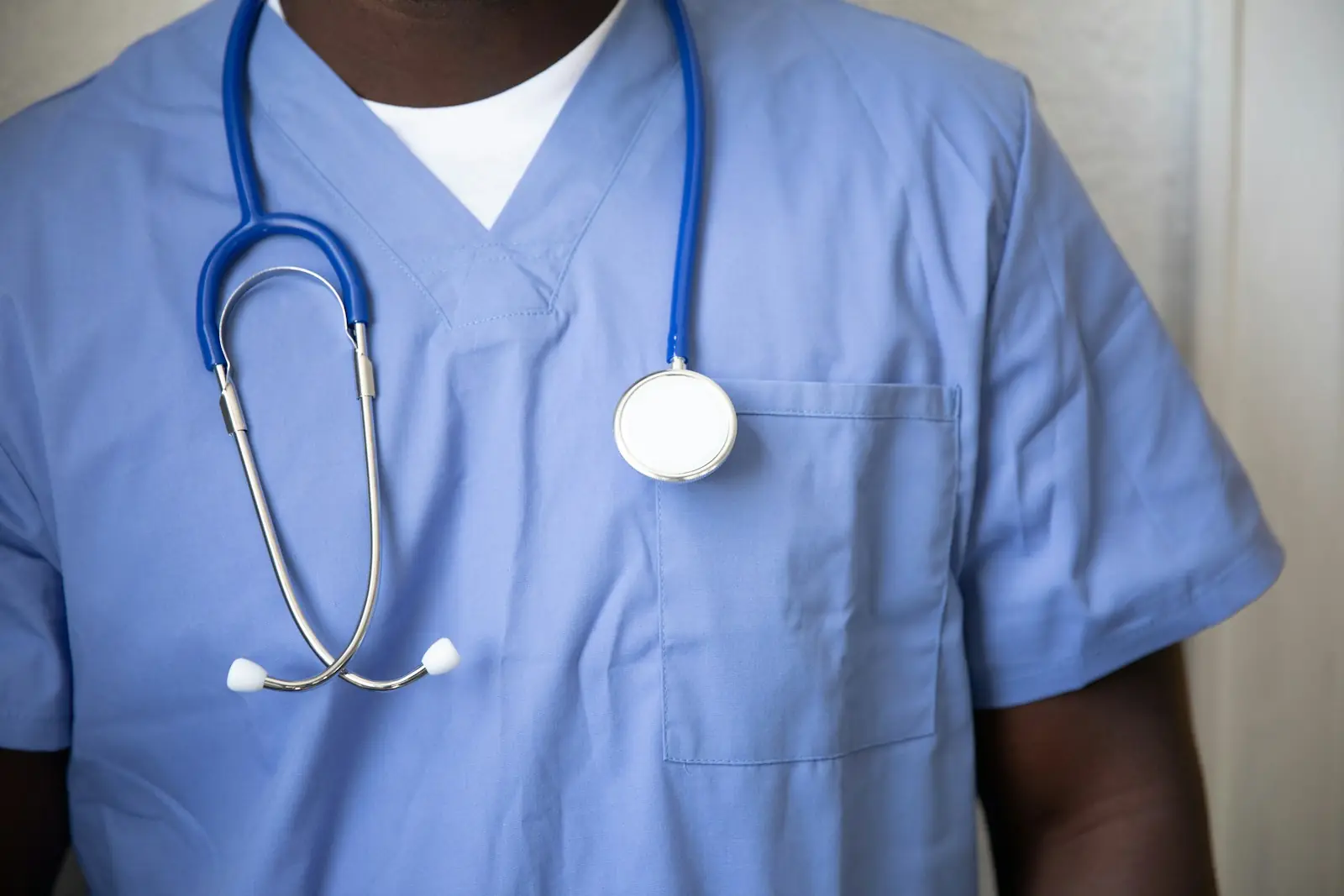 Healthcare worker in blue medical scrubs